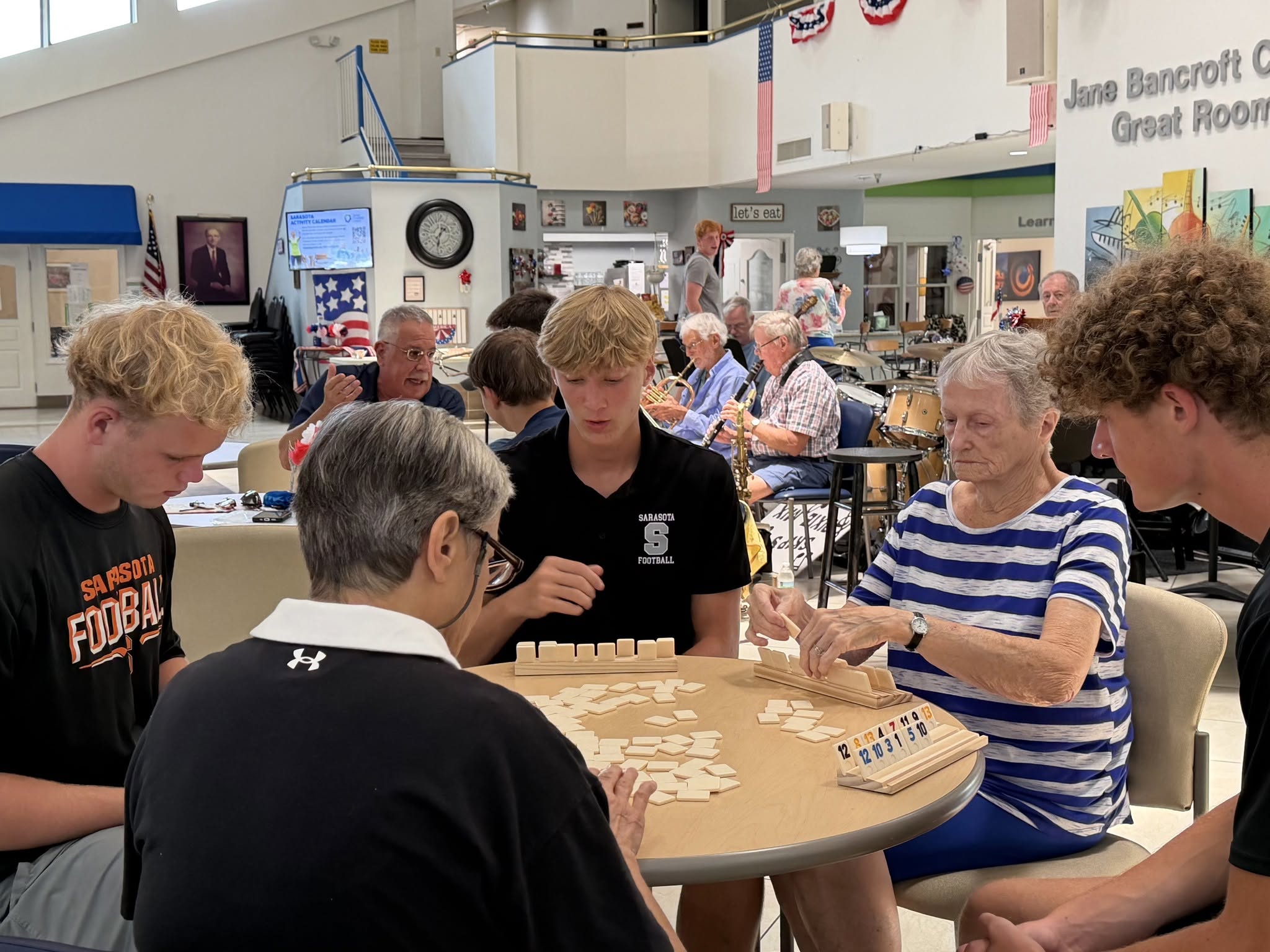 Sarasota Football players visiting Senior Friendship Centers