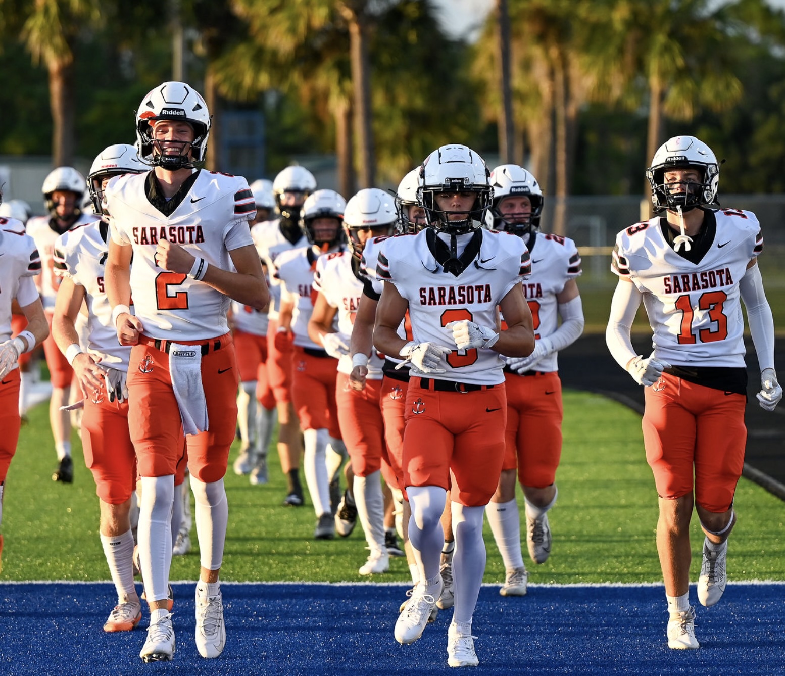 Sarasota Football players gathered together as a team